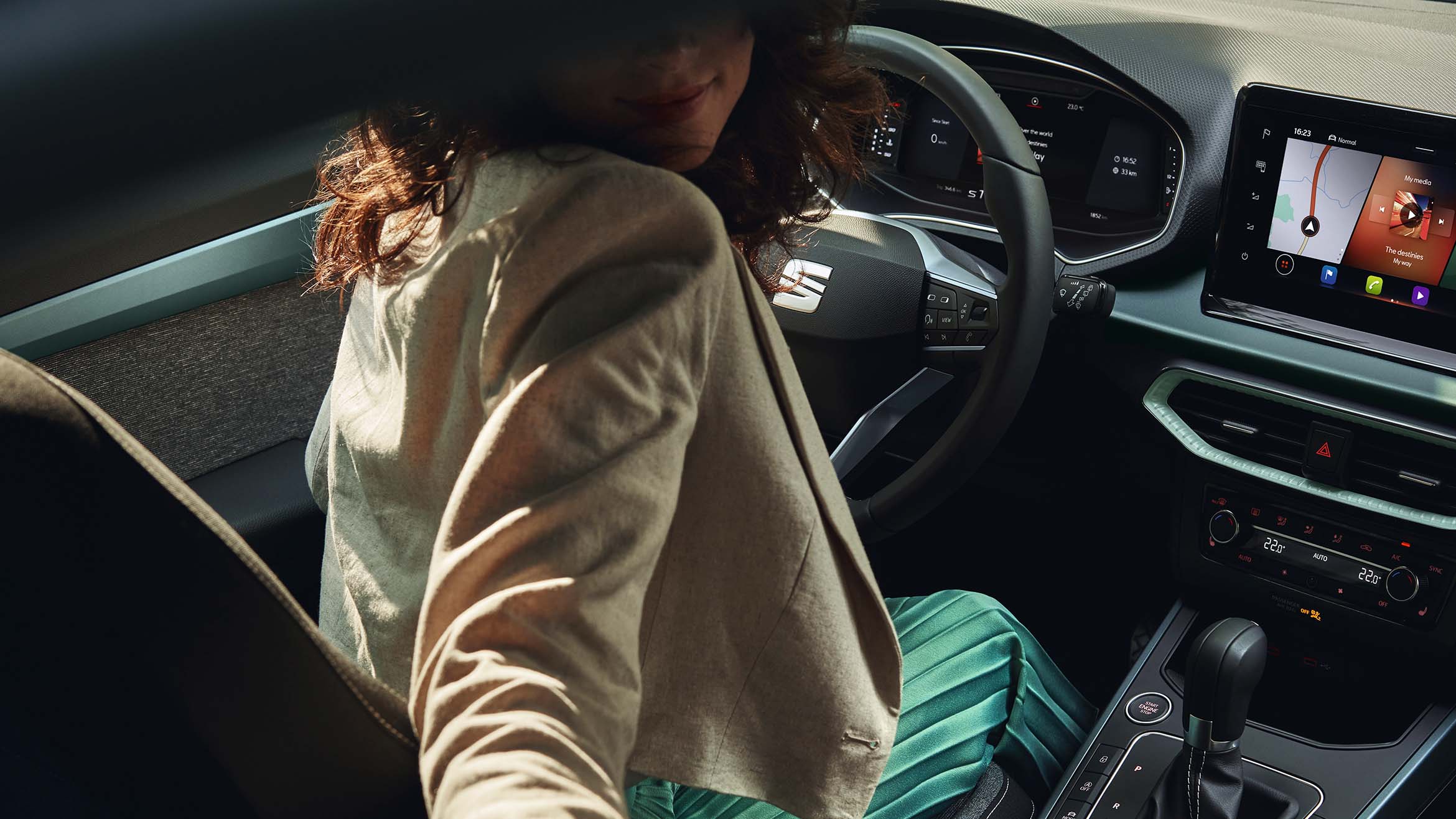 woman sitting in seat arona