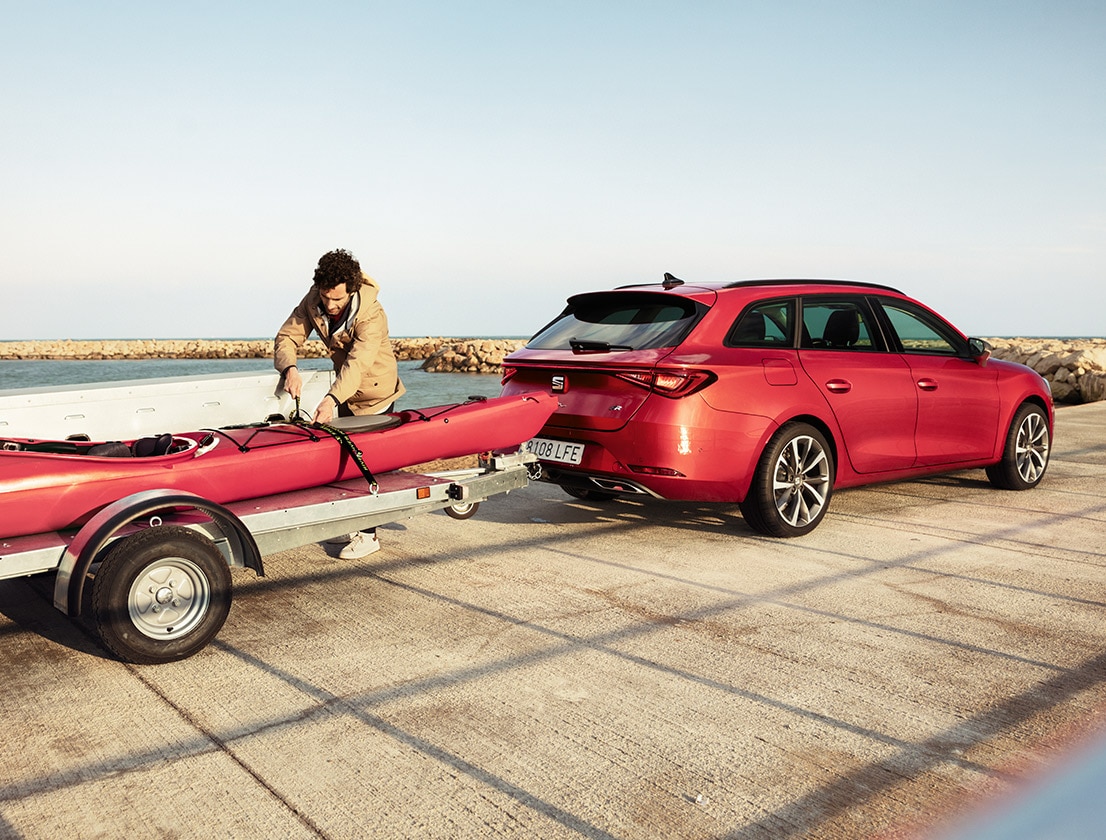 man setting up seat tow bar car accessories