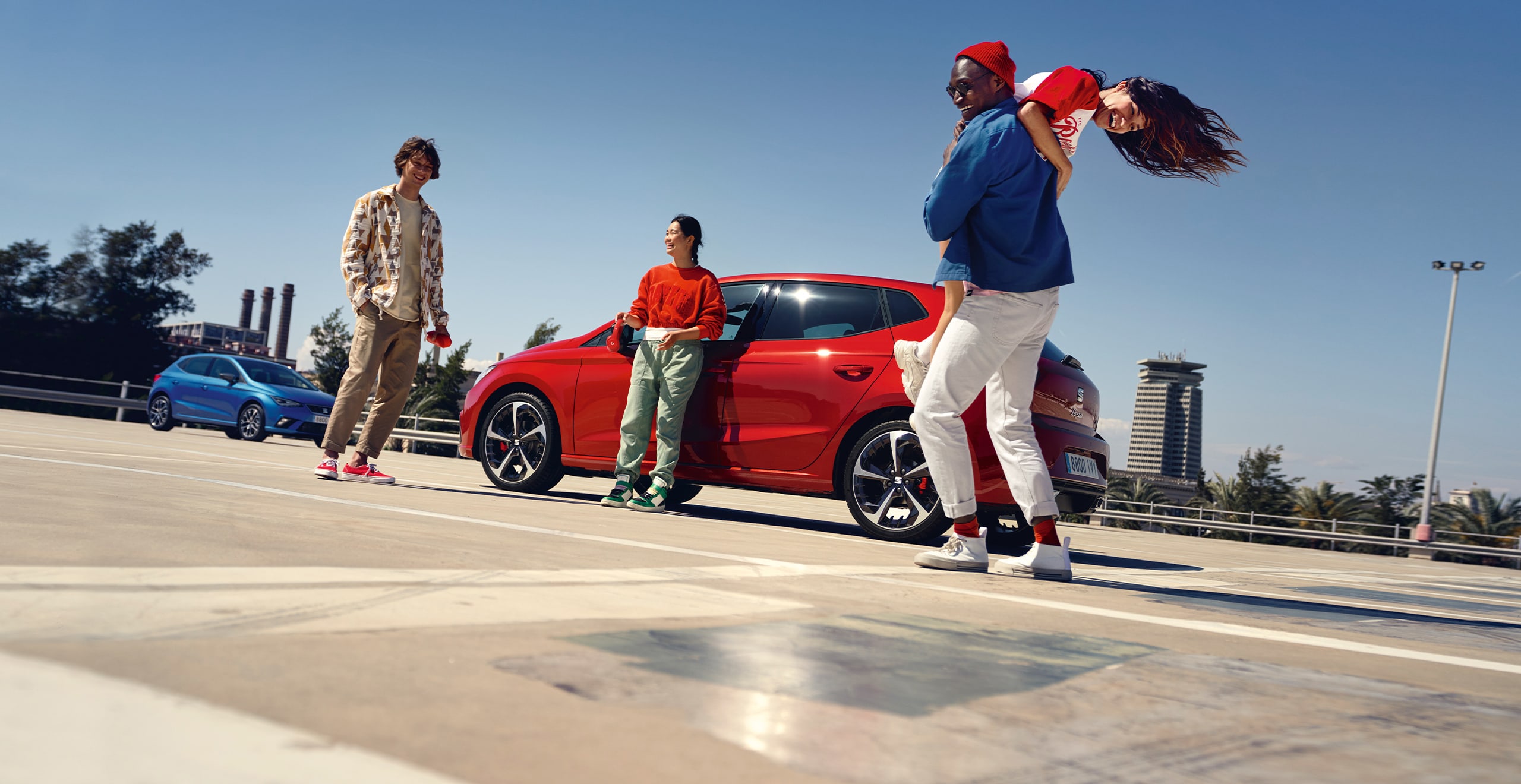 Friends hanging out in the SEAT Ibiza desire red colour 