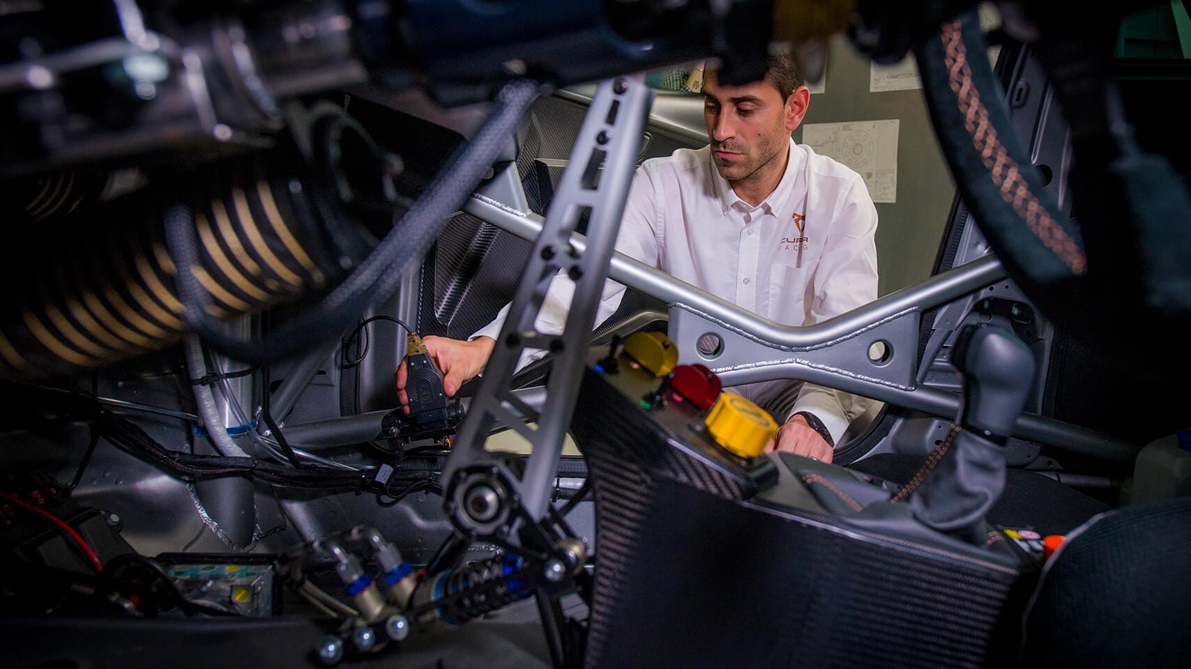 > Interior of CUPRA sportive car with worker testing 